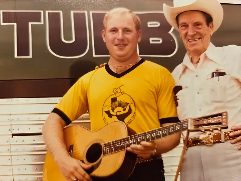 Max with Ernest Tubb, holding Jimmy Rogers' guitar,1978